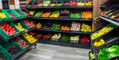 A photo of some fruit and vegetable mobile display units